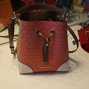 Michael Kors Orange and Cream Monogram Drawstring Crossbody Bag